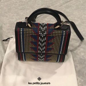 a like new les petits joururs top handle bag